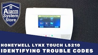 How To Clear Trouble Conditions On Honeywell Lynx L5210  AlarmSystemStore [upl. by Idnal]