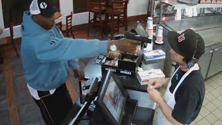 Watch Unfazed Cashier Keep His Cool During Terrifying Gunpoint Robbery [upl. by Greenfield]